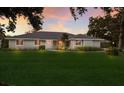 Inviting single-story home with manicured lawn, charming landscaping, and a welcoming entrance at 1411 70Th Nw St, Bradenton, FL 34209