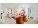Bright living room with high ceilings, neutral walls, and modern decor with cozy seating at 1711 Pelican Cove Rd # 443, Sarasota, FL 34231