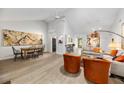 Open-concept living space with dining area, modern furnishings, and plenty of natural light at 1711 Pelican Cove Rd # 443, Sarasota, FL 34231