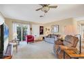 Cozy living room with neutral walls, a ceiling fan, and comfortable seating at 2267 Pueblo Ln # V40, Sarasota, FL 34231