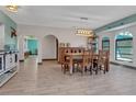 Bright dining room with stylish furnishings and a view of the water at 23088 Allen Ave, Port Charlotte, FL 33980