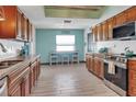 Well-lit kitchen featuring ample cabinetry and modern stainless steel appliances at 23088 Allen Ave, Port Charlotte, FL 33980