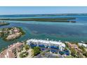 Aerial view of condo complex with waterfront access and beautiful ocean view at 615 Dream Island Pl # 303, Longboat Key, FL 34228