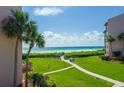 Beautiful beachside condo featuring direct beach access and lush landscaping at 6480 Midnight Pass Rd # 316, Sarasota, FL 34242