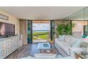 Comfortable living room with views of the Gulf from the lanai at 6480 Midnight Pass Rd # 316, Sarasota, FL 34242