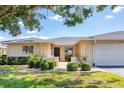 Lovely condo with a well-kept front yard, a charming patio, and an attached garage at 7069 W Country Club N Dr # 7069, Sarasota, FL 34243