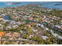 An aerial view shows the property with waterfront access and stunning neighborhood canal views at 717 Treasure Boat Way, Sarasota, FL 34242