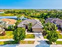 Aerial view of the property showcasing the home, landscaping, and scenic surroundings at 13644 Brilliante Dr, Venice, FL 34293