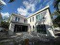 Modern home under construction, revealing its architectural design and open outdoor space at 1423 S Shade Ave, Sarasota, FL 34239