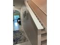 Open entryway with staircase featuring carpeted steps and visible dining room and living area at 16919 Trite Bend St, Wimauma, FL 33598