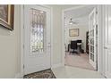 Bright foyer with decorative glass front door and an office just off the entrance at 17640 Northwood Pl, Bradenton, FL 34202