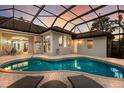 Inviting screened-in pool area with lounge chairs, perfect for relaxing and entertaining at 2309 Chardonnay Ter, Parrish, FL 34219