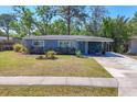 Well-maintained home with inviting front yard and covered entry porch at 2350 Novus St, Sarasota, FL 34237