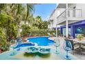 Backyard pool with lounge chairs and outdoor seating at 316 64Th St, Holmes Beach, FL 34217
