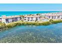 Beautiful waterfront complex featuring direct beach access and many amenities at 3540 Gulf Of Mexico Drive # 202, Longboat Key, FL 34228