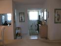 Inviting entryway with decorative accents and natural light streaming through the window at 3620 Ironwood Cir # 506-O, Bradenton, FL 34209