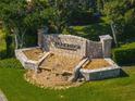 Stone Parkridge community sign with waterfall feature is surrounded by manicured landscaping at 3671 Parkridge Cir # 8-201, Sarasota, FL 34243