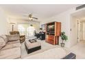 Cozy living room with ceiling fan and sliding door with access to an outdoor balcony at 3690 Pinecrest St # 124, Sarasota, FL 34232