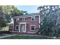 Charming two-story home with mature trees and traditional architecture provides unique curb appeal at 624 19Th W St, Bradenton, FL 34205