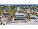 Beachfront home featuring contemporary design, elevated construction, and beautiful oceanfront community at 6603 Gulfside Rd, Longboat Key, FL 34228