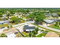 Home is nestled in a tranquil neighborhood surrounded by lush greenery, offering a serene living environment at 6628 Keystone Dr, Sarasota, FL 34231