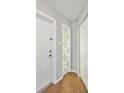 Welcoming foyer features decorative tile flooring and unique glass block window at 219 Marlin Dr, Punta Gorda, FL 33950