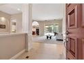 Inviting foyer leads to spacious living room with pool view and open floor plan at 3738 Eagle Hammock Dr, Sarasota, FL 34240