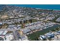 Aerial view of neighborhood featuring waterfront homes with boat docks and canal access at 444 63Rd St, Holmes Beach, FL 34217