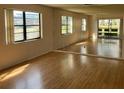 Bright living room featuring mirrored wall and sliding glass doors at 5970 80Th N St # 101, St Petersburg, FL 33709