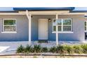 Inviting front entrance with modern door and landscaping at 6009 Lords Ave, Sarasota, FL 34231