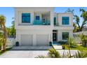 Modern two-story home with a two-car garage and a minimalist yard and landscaping at 1842 Kenilworth St, Sarasota, FL 34231