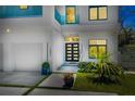 Contemporary home showcasing clean lines, modern front door, and manicured landscaping at 1842 Kenilworth St, Sarasota, FL 34231