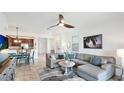Bright and spacious living room featuring tile flooring and a cozy seating area at 20398 Lagente Cir, Venice, FL 34293