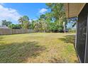 Expansive backyard with privacy fence, ideal for outdoor activities and entertaining at 2906 Arlington St, Sarasota, FL 34239