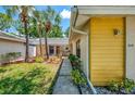 Charming front yard with lush landscaping and a quaint walkway to the entrance at 314 Pembroke Ln # 189, Venice, FL 34293