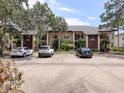 Condo building with ample parking spaces and well-maintained grounds at 4315 45Th W Ave # 103, Bradenton, FL 34210