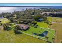 Expansive property featuring a well-manicured lawn, a picturesque pond, and private fencing at 4610 13Th W St, Palmetto, FL 34221