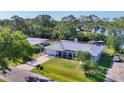 Well-maintained home featuring lush landscaping, a spacious driveway, and a charming exterior at 5206 18Th E Ave, Bradenton, FL 34208