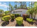 Cypress Strand at The Preserve community sign surrounded by lush landscaping and palm trees at 6339 Bay Cedar Ln # 102, Bradenton, FL 34203
