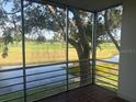 Serene views of the golf course and waterway from the screened-in patio at 7461 W Country Club N Dr # 201, Sarasota, FL 34243