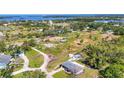 Aerial view of a property with a large lot, presenting potential for development and outdoor activities at 80 Liles St, Terra Ceia, FL 34250