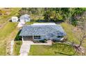 Charming single-story home with a well-maintained lawn and landscaping, creating curb appeal at 80 Liles St, Terra Ceia, FL 34250