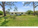 Charming single-story home with a well-manicured front lawn at 815 31St W Ave, Palmetto, FL 34221