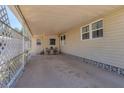 Spacious carport area offering covered parking and an outdoor seating space at 1307 41St E Ave, Ellenton, FL 34222