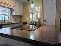 Well-maintained kitchen featuring updated countertops and fixtures, offering a functional and clean cooking space at 2107 Palma Sola Blvd # 95, Bradenton, FL 34209