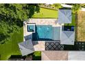 Aerial view showcasing the private backyard pool, spa, putting green, and outdoor entertainment space at 2202 Alpine Ave, Sarasota, FL 34239