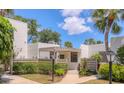 Charming condo featuring a well-maintained exterior with lush landscaping and a private entrance at 308 Timber Lake Dr, Bradenton, FL 34210