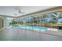 A screened-in pool with a hot tub offers a private outdoor experience for relaxation and recreation at 3572 Ferndell, Sarasota, FL 34235