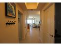 Inviting hallway leading to an open-concept living area with neutral colors at 501 Haben Blvd # 704, Palmetto, FL 34221