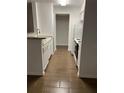 Modern kitchen featuring granite counters, stainless steel appliances, and wood floors at 8617 Fancy Finch Dr # 102, Tampa, FL 33614